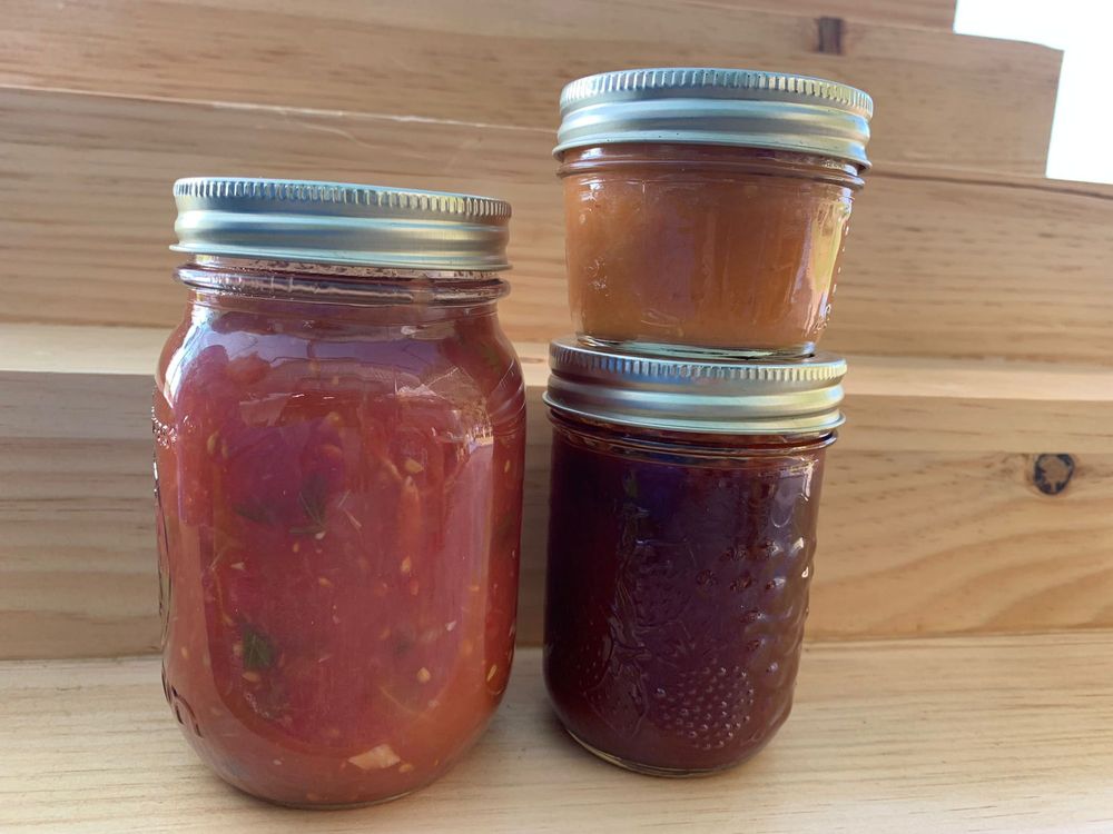 Jars of homemade salsa and sauces
